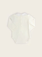 A classic pique bodysuit in white with a Danish soldiers embroidered onto the collar rear view.