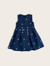Blue nautical denim girls dress featuring white embroidered anchor and ships wheel motifs