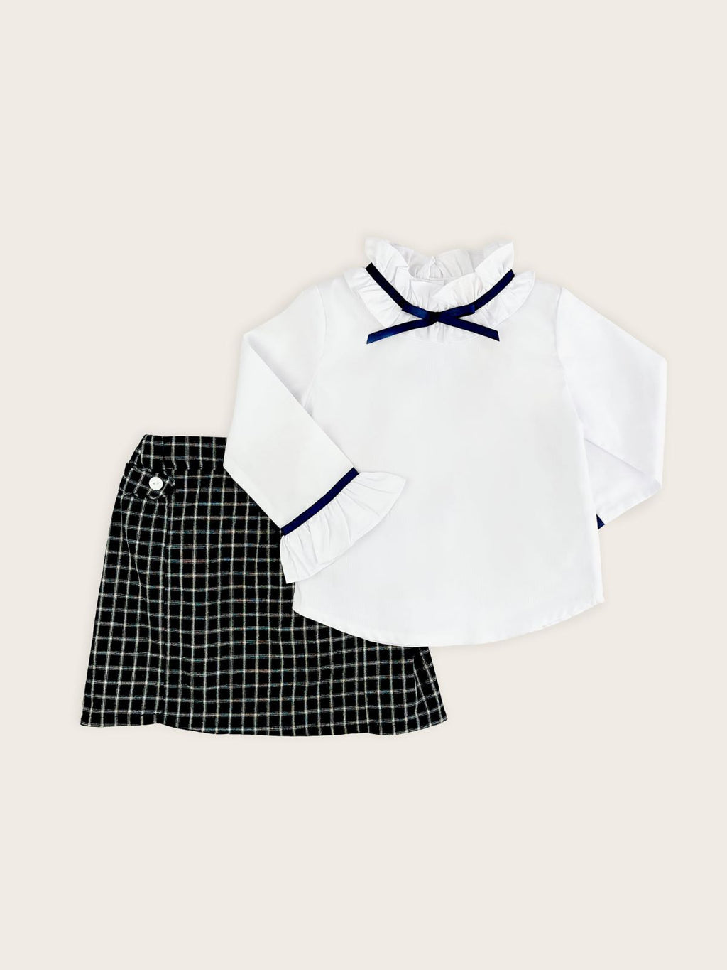 Girls white blouse with blue grosgrain ribbon collar paired with French Navy Check skirt