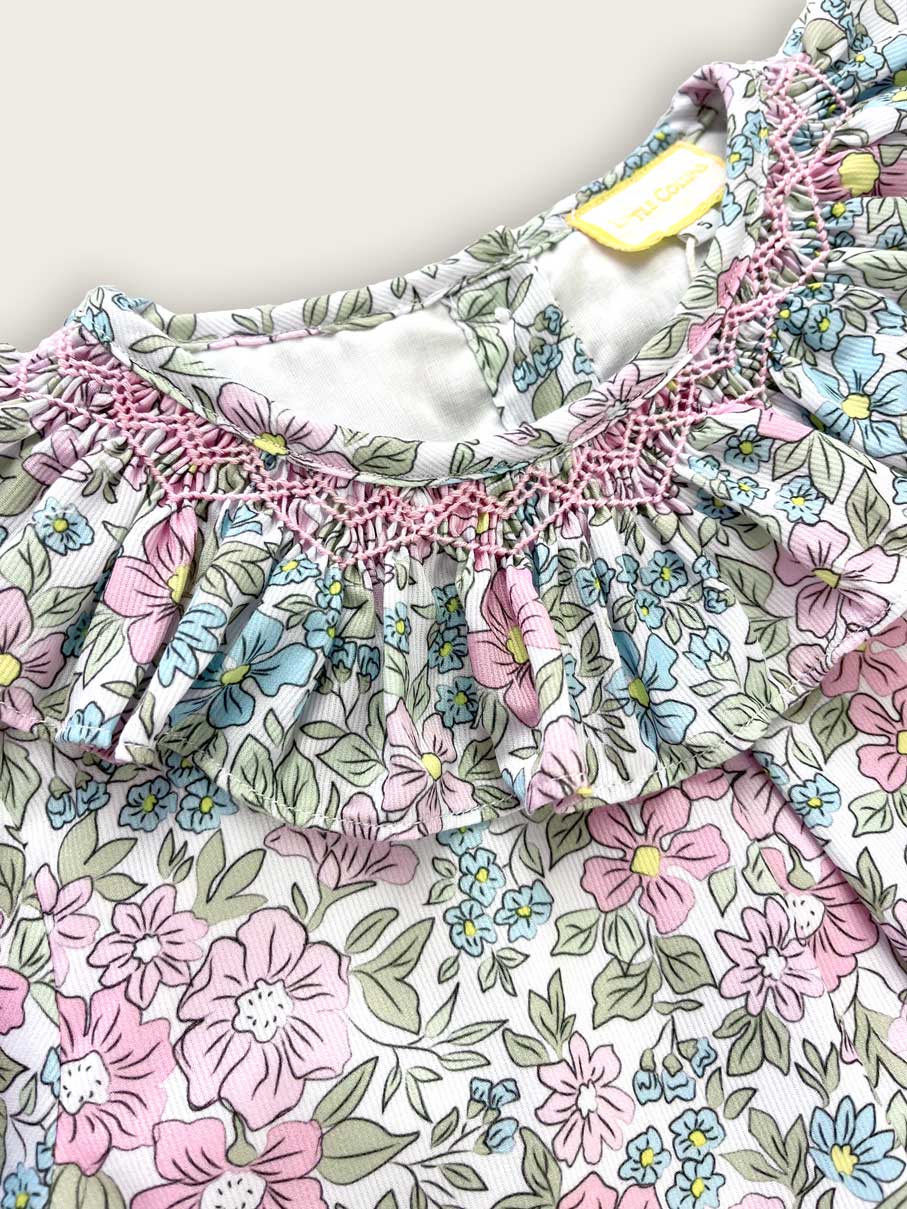 Floral children's dress with matching bloomers, featuring a frilled collar with hand smocking.